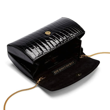 Black crocodile-patterned handbag with gold chain on a white background