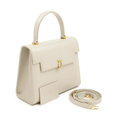 Beige handbag with gold accents on a white background