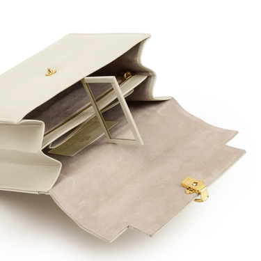 Beige jewelry box with gold accents on a white background