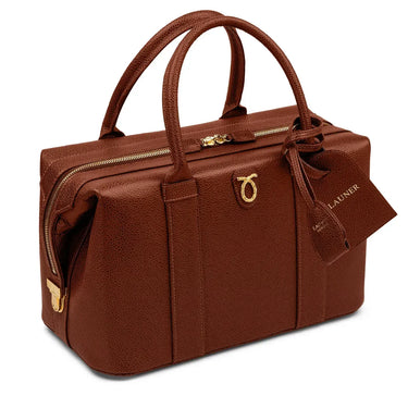 Brown leather handbag with gold accents on a white background