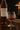 Bottle of Castaréde Bas Armagnac 1979 with a glass of Armagnac on a dark surface.