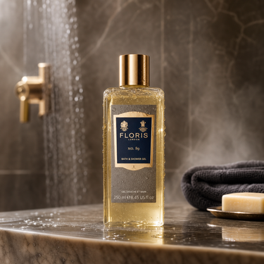 Floris 89 bath and shower gel bottle on a bathroom counter with steam in the background