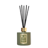 Green Floris diffuser bottle with black sticks on a white background