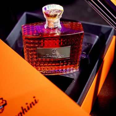 Luxury brandy bottle with 'Lamborghini' branding on a matching box.